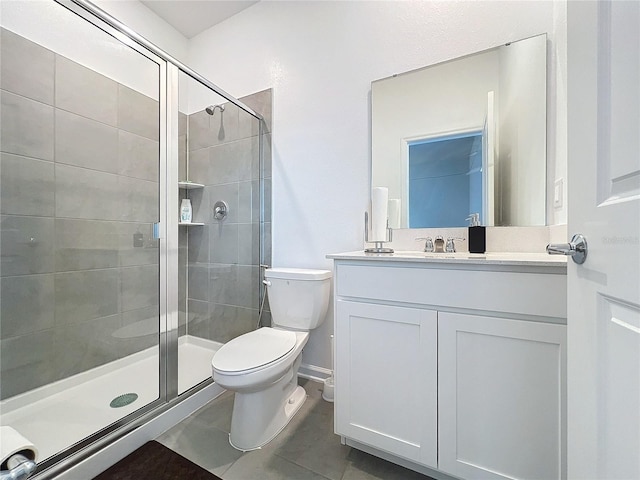 bathroom featuring tile patterned floors, vanity, toilet, and an enclosed shower