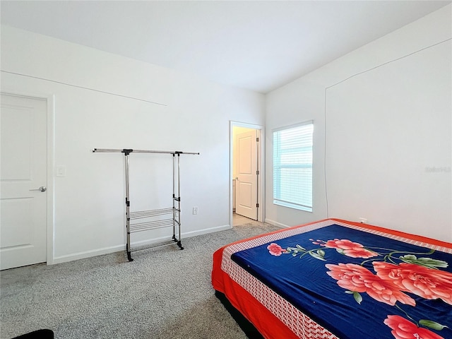 bedroom featuring light carpet