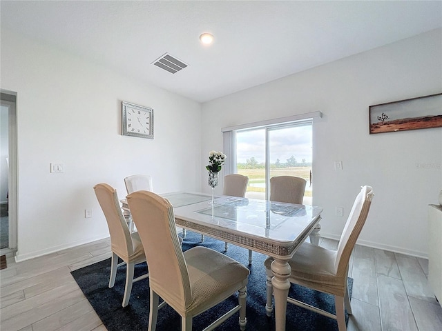 dining space featuring light hardwood / wood-style flooring