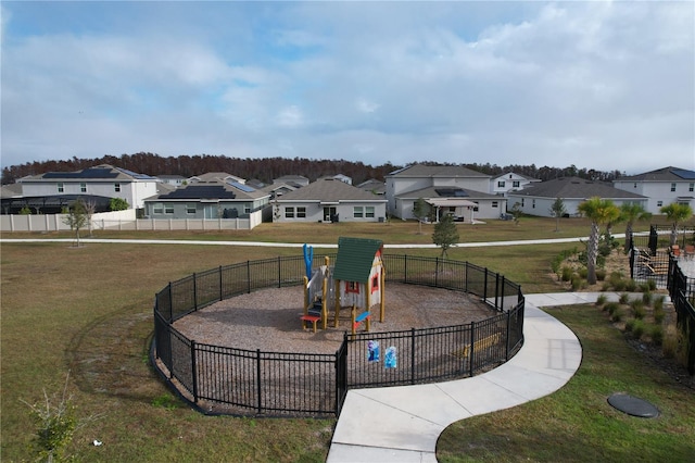 view of property's community with a lawn and a playground