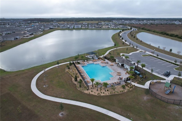 birds eye view of property featuring a water view