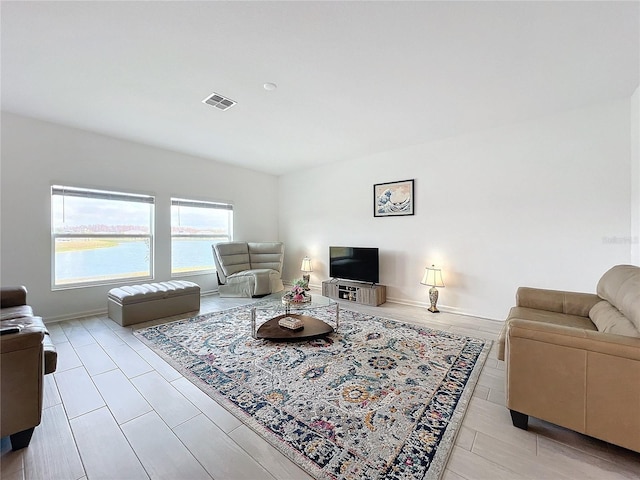 living room with light hardwood / wood-style flooring