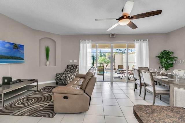 tiled living room featuring ceiling fan