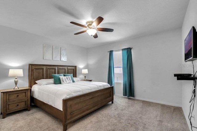 bedroom with light colored carpet and ceiling fan