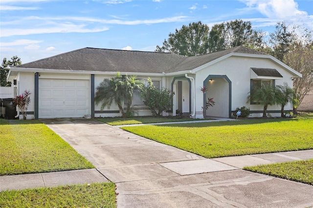 ranch-style house featuring a front lawn and a garage