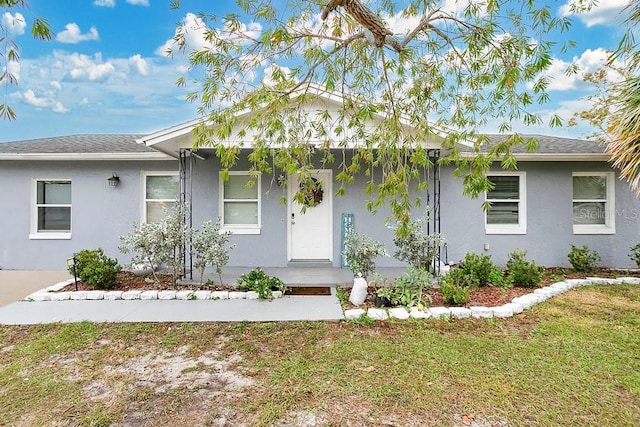 ranch-style home with a front yard