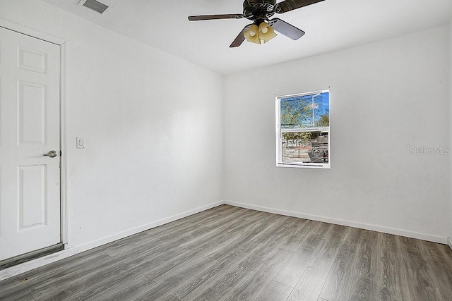 unfurnished room featuring hardwood / wood-style flooring and ceiling fan