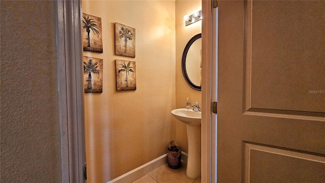 bathroom with tile patterned floors