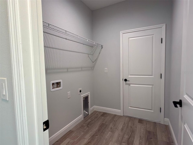 washroom featuring wood-type flooring, washer hookup, and hookup for an electric dryer