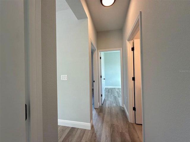 corridor featuring light hardwood / wood-style flooring