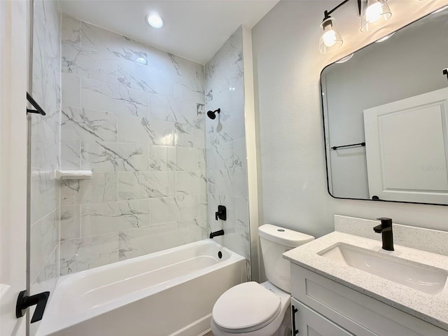 full bathroom with vanity, toilet, and tiled shower / bath