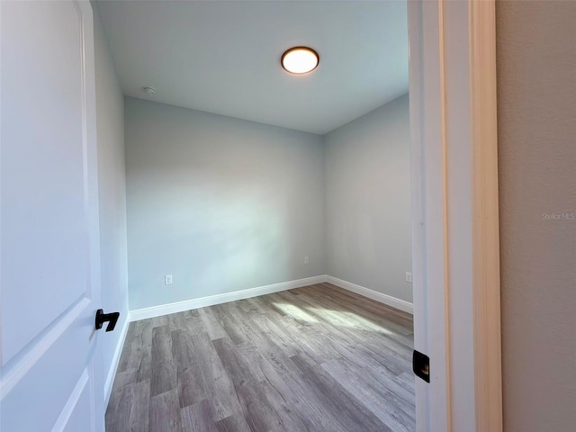 unfurnished room with light wood-type flooring