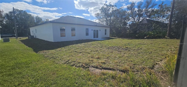 view of property exterior with a lawn