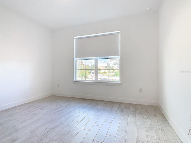 unfurnished room with light hardwood / wood-style floors