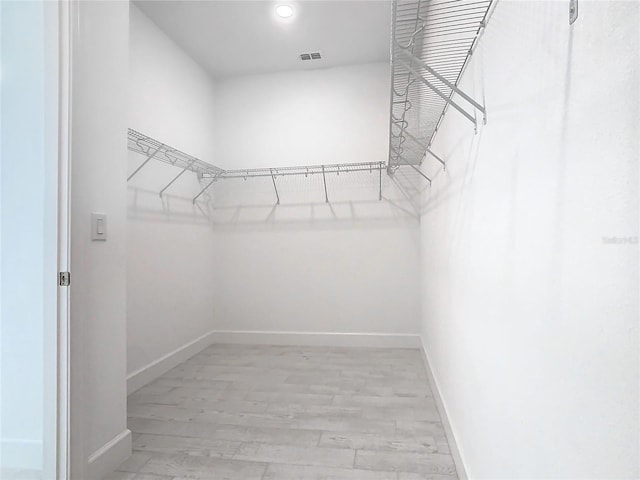 195 Casavista Dr, Kissimmee, FL 34759 - walk in closet with visible vents and light wood-style flooring