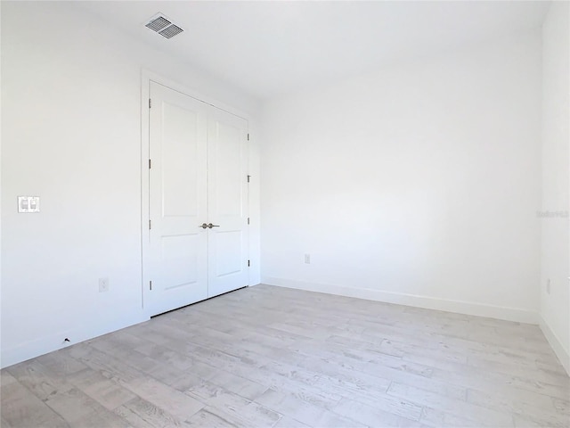 195 Casavista Dr, Kissimmee, FL 34759 - unfurnished bedroom featuring baseboards, a closet, light wood-type flooring, and visible vents