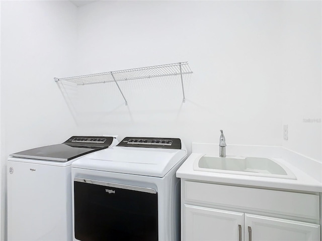 195 Casavista Dr, Kissimmee, FL 34759 - washroom featuring washer and dryer, cabinet space, and a sink