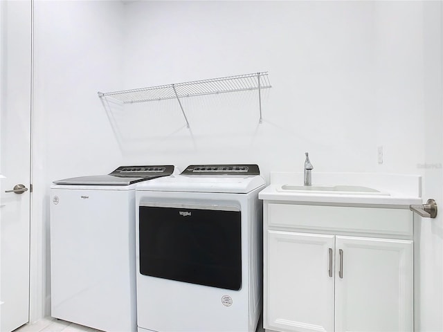 195 Casavista Dr, Kissimmee, FL 34759 - laundry area featuring cabinet space, washing machine and dryer, and a sink
