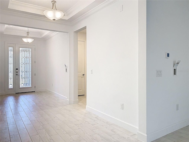 195 Casavista Dr, Kissimmee, FL 34759 - foyer featuring light wood finished floors, baseboards, a raised ceiling, and ornamental molding