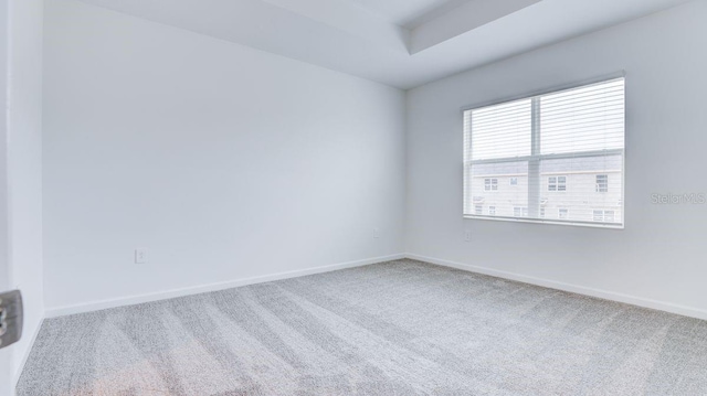 unfurnished room featuring carpet flooring