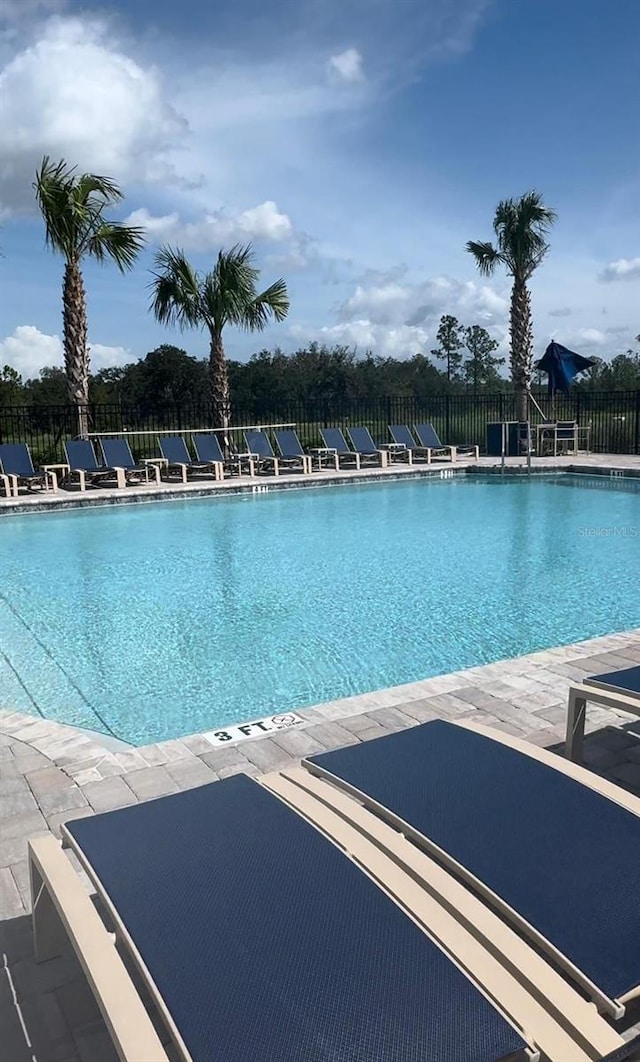 view of swimming pool featuring a patio