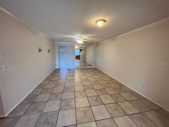 tiled spare room with ceiling fan, crown molding, and a textured ceiling