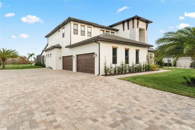 exterior space featuring a front yard and a garage