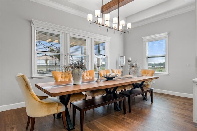 dining room with crown molding, dark hardwood / wood-style flooring, and a notable chandelier