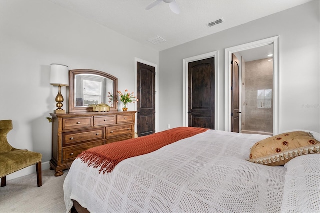 carpeted bedroom featuring ceiling fan and connected bathroom