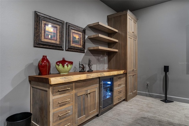 bar with beverage cooler and butcher block counters