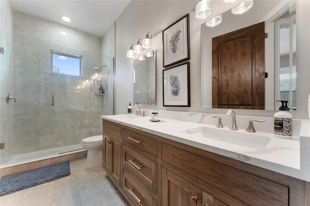 bathroom with vanity, a shower with shower door, and toilet