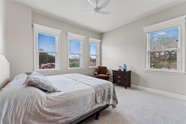 bedroom with ceiling fan and carpet