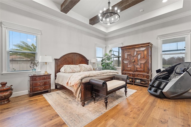 bedroom with a raised ceiling, crown molding, light wood-type flooring, beamed ceiling, and a notable chandelier