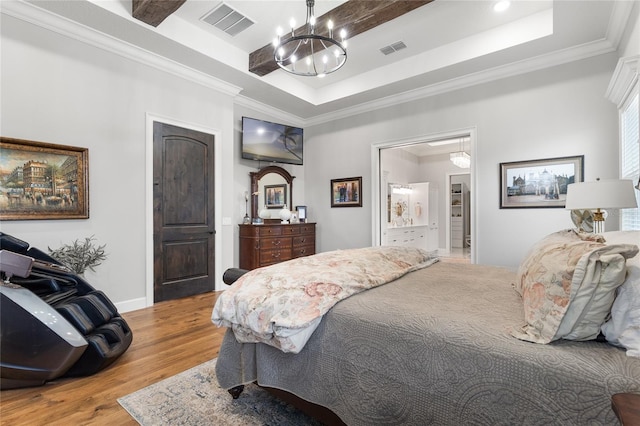 bedroom featuring a raised ceiling, light hardwood / wood-style flooring, crown molding, and a notable chandelier