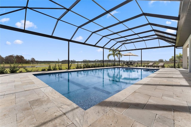 view of swimming pool with a lanai and a patio