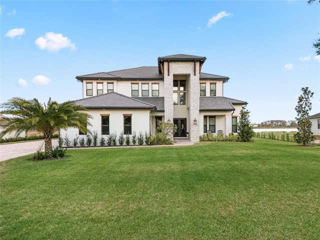 prairie-style home with a front yard