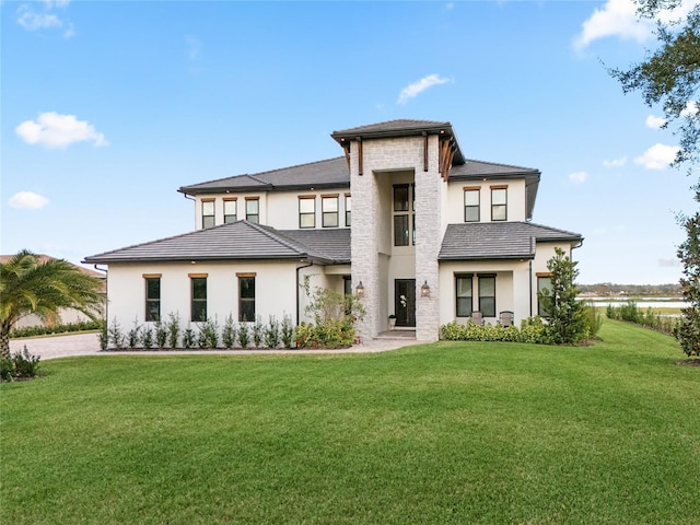 view of front of home with a front lawn