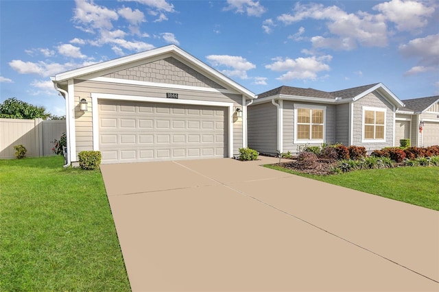 ranch-style home with a garage and a front lawn