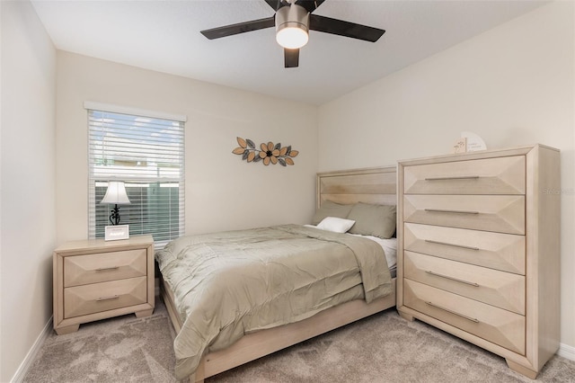 bedroom featuring light carpet and ceiling fan