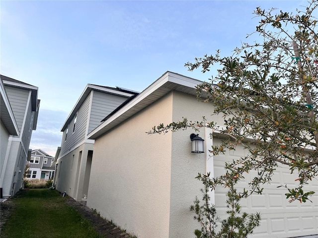 view of home's exterior with a garage