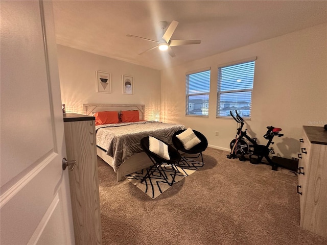 bedroom with ceiling fan and carpet floors