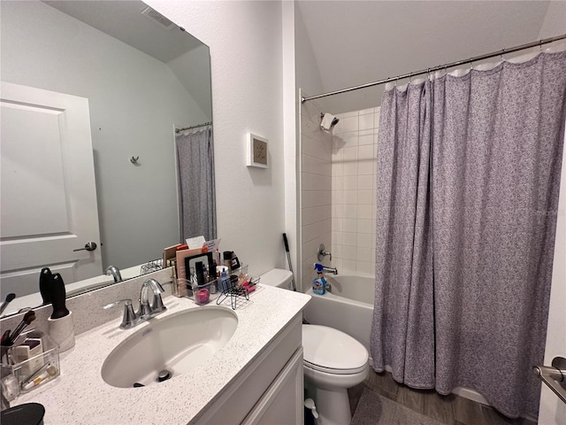 full bathroom featuring hardwood / wood-style flooring, vanity, toilet, and shower / bath combo with shower curtain