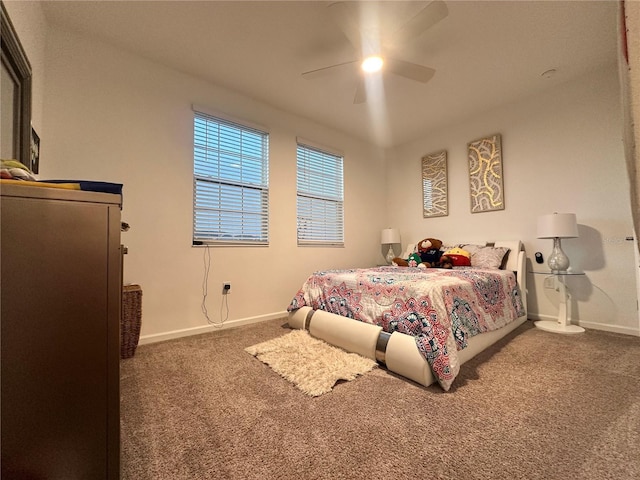 bedroom with ceiling fan and dark carpet