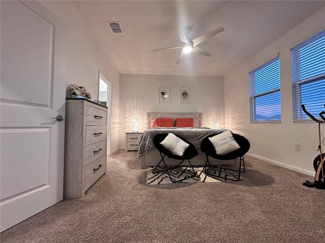 bedroom with ceiling fan and carpet floors