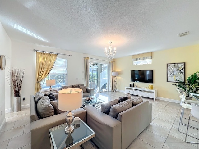 living room featuring light tile patterned floors and a chandelier