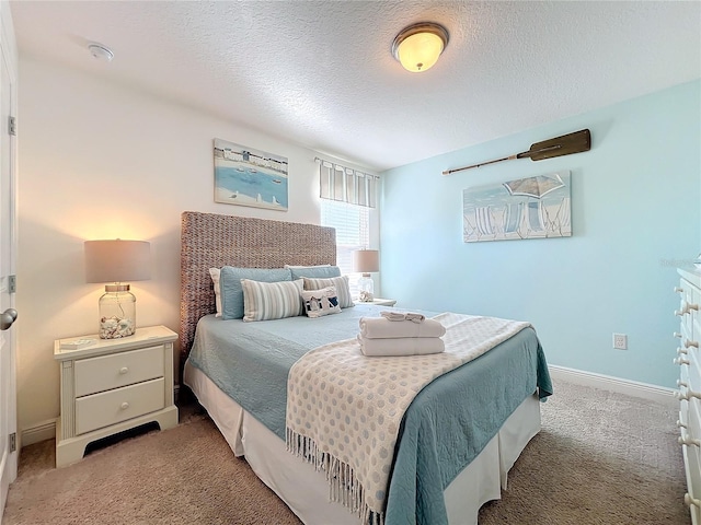 carpeted bedroom with a textured ceiling