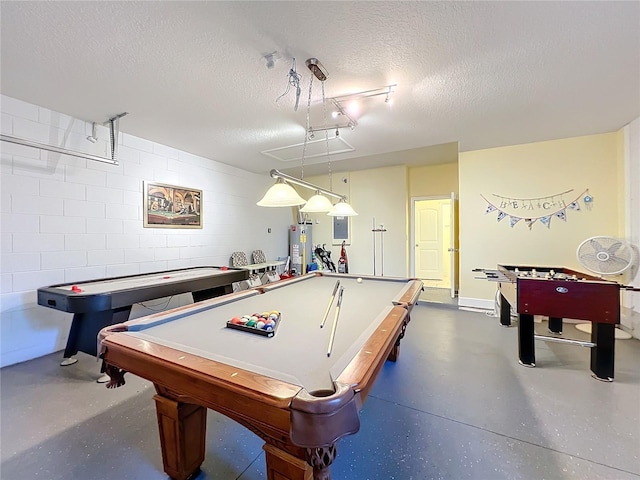 playroom with water heater, a textured ceiling, and pool table