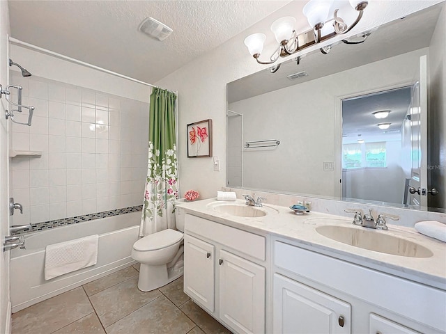 full bathroom with tile patterned flooring, a textured ceiling, toilet, shower / tub combo with curtain, and vanity