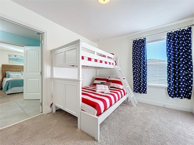 carpeted bedroom with a textured ceiling