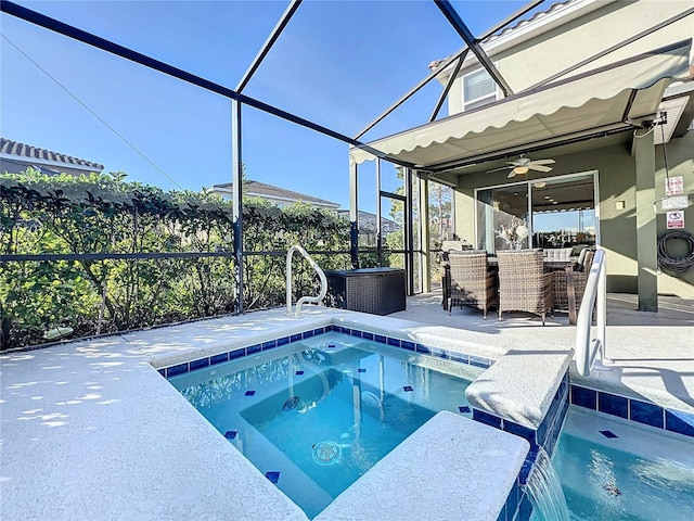 view of swimming pool with ceiling fan, a lanai, a jacuzzi, pool water feature, and a patio